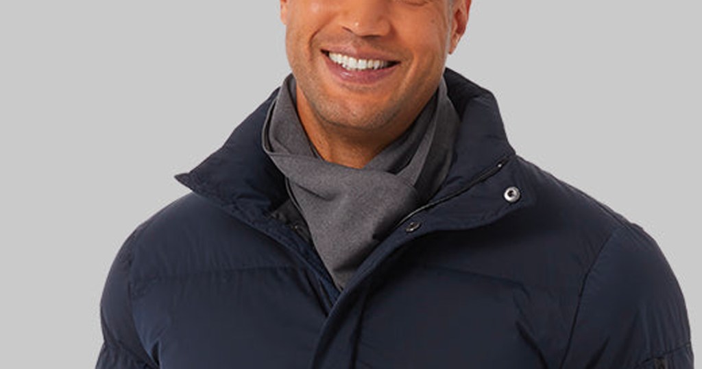 man wearing gray scarf with blue jacket