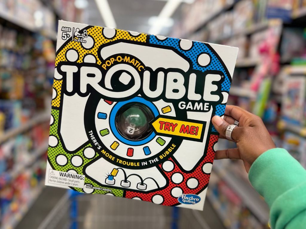Trouble Board game in person's hand