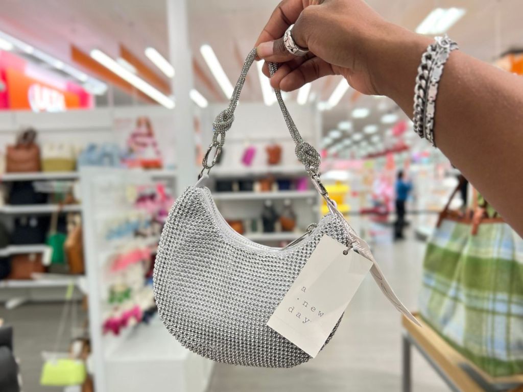 a womans hand displaying A New Day Elise Micro Handbag
