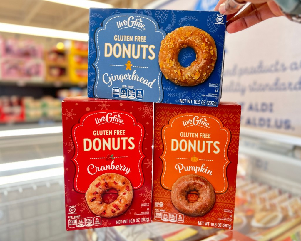 3 boxes of Aldi gluten free donuts in various holiday flavors like pumpkin and gingerbread
