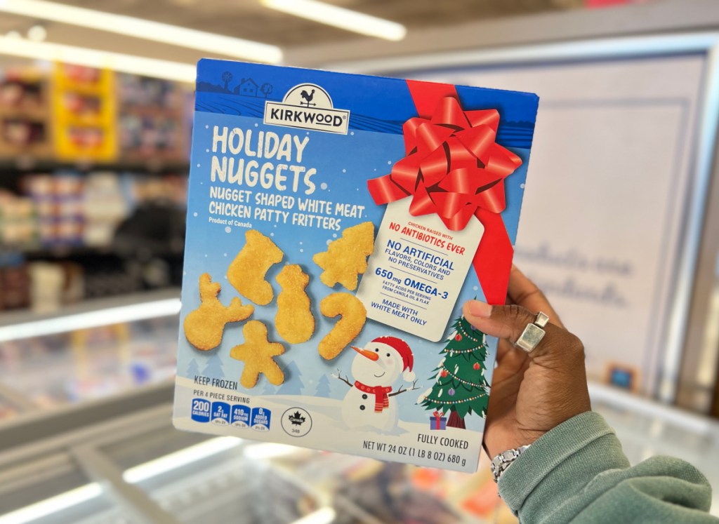 Hand holding up a box of Aldi Holiday nuggets from our list of Aldi Grocery Finds