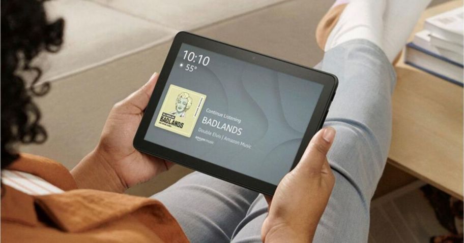 A person holding an Amazon Fire Tablet