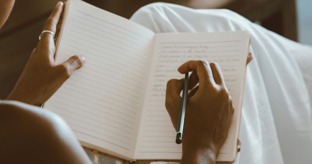 Woman writing in a journal