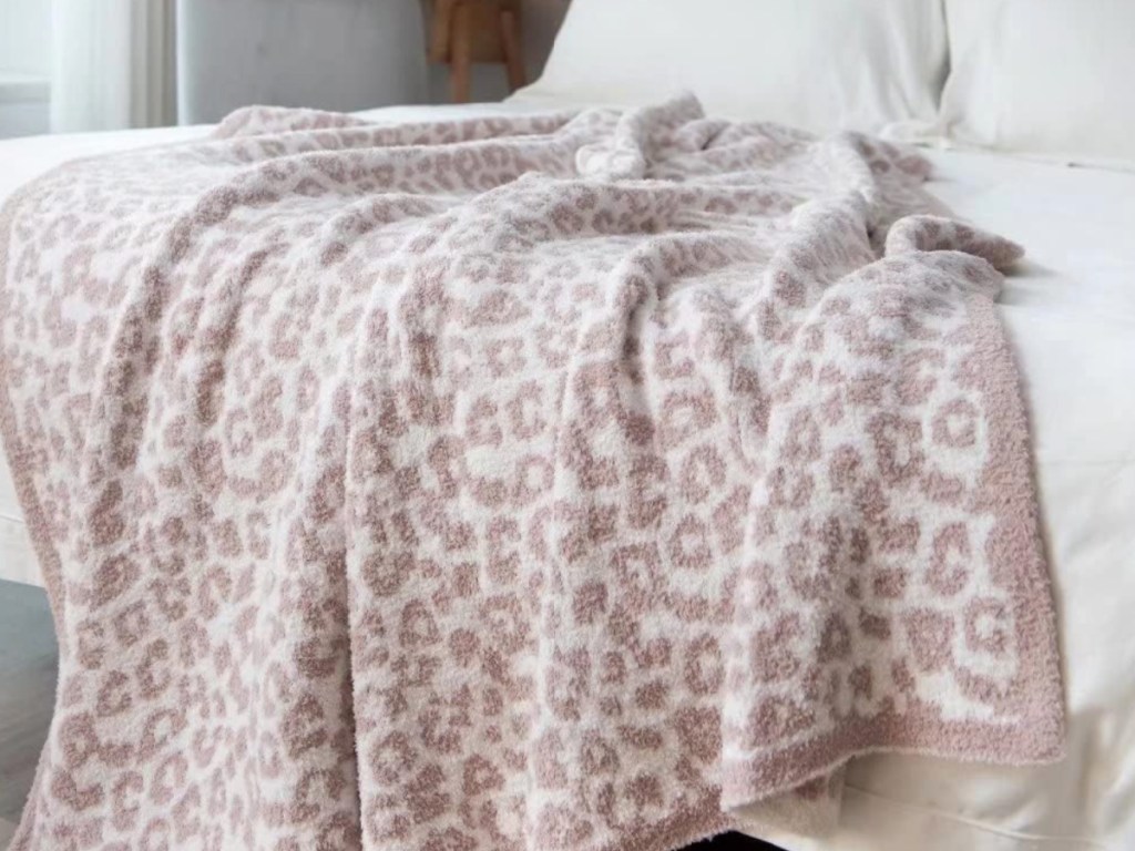 Amazon Leopard Throw Blanket draped on bed