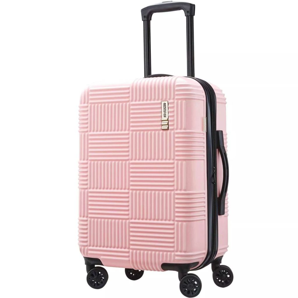 American Tourister NXT Hardside Carry On Spinner Suitcase in Pink stock image