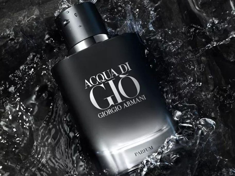A bottle of. Armani Acqua Di Gio in dark water