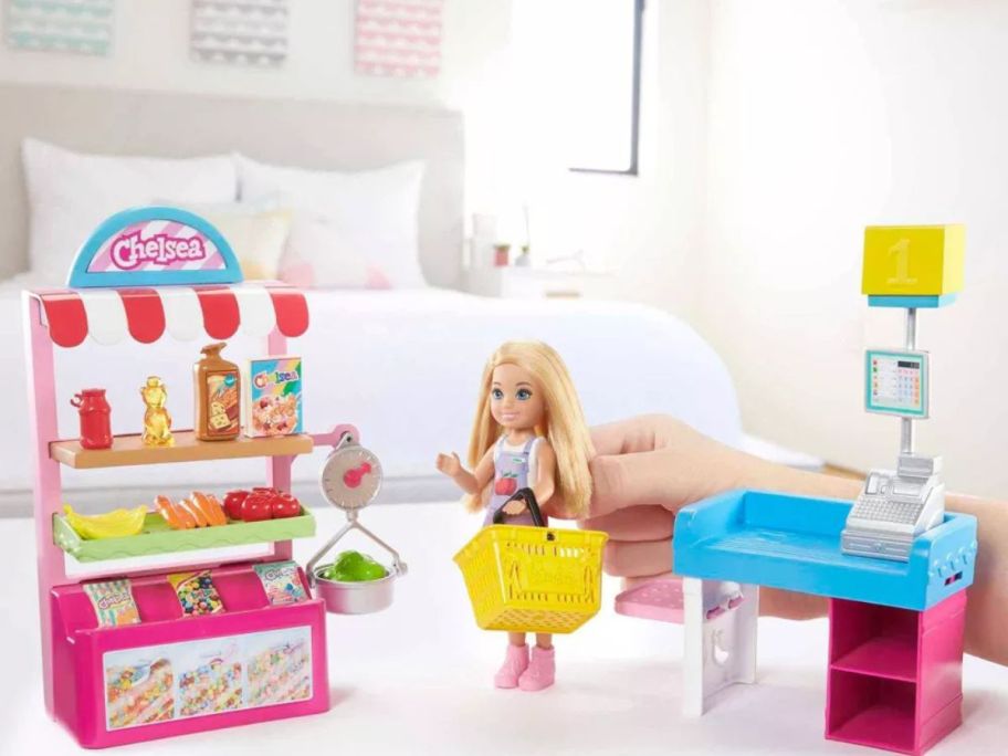 kid playing with Barbie Chelsea Can Be Doll & Snack Stand Playset