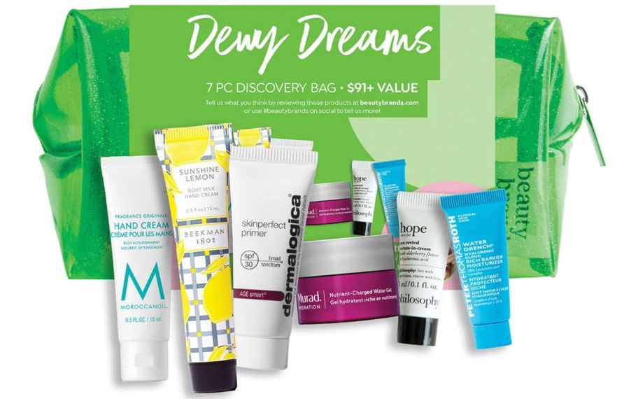 Green beauty bag with mini skin care products in front of it