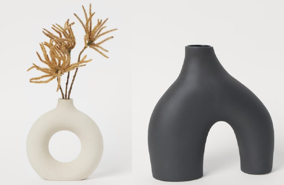 Beige vase with flower and large black vase