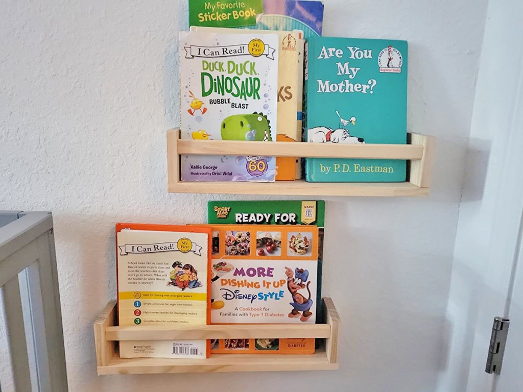 books on wooden shelves in kids room