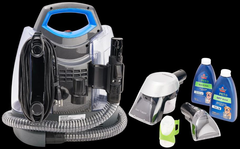 the Bissell Little Green ProHeat Pet Deluxe Deep Cleaner shown with included accessories and cleaners