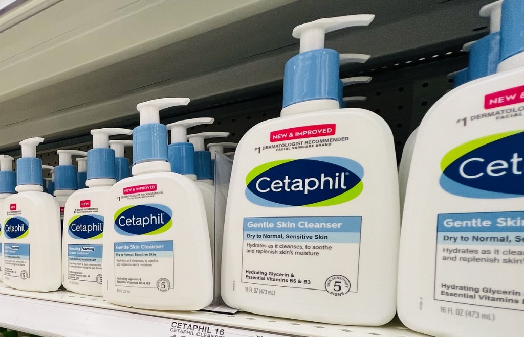 white and blue bottles of Cetaphil Hydrating Gentle Skin Cleanser on store shelf