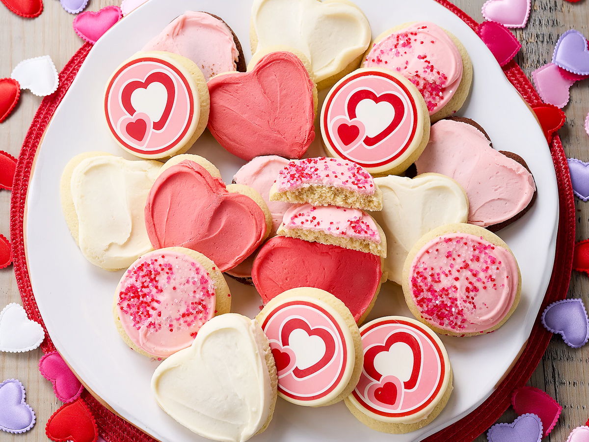 plate full of valentine's day frosted cookies