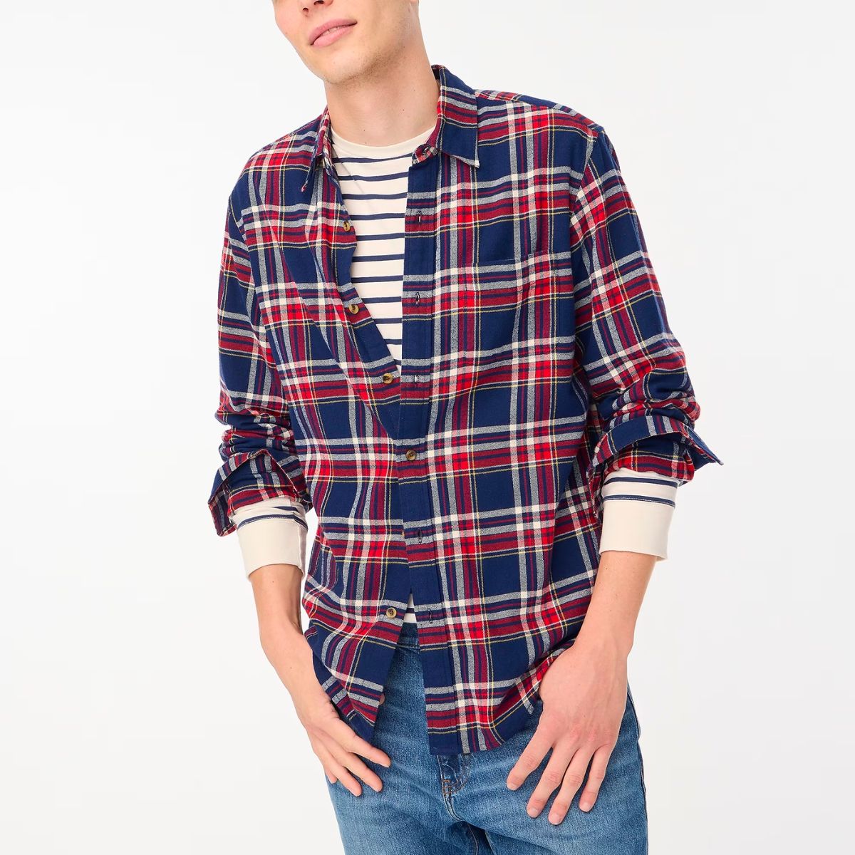 a male model wearing a j crew factory classic plaid flannel shirt in navy blue and red