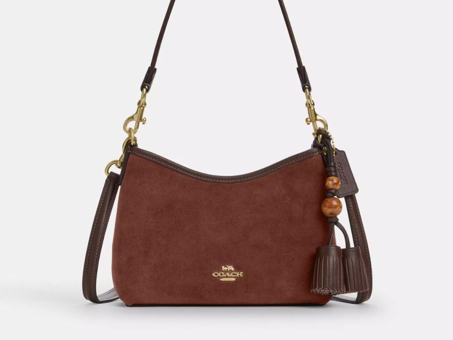A brown purse with a tassel