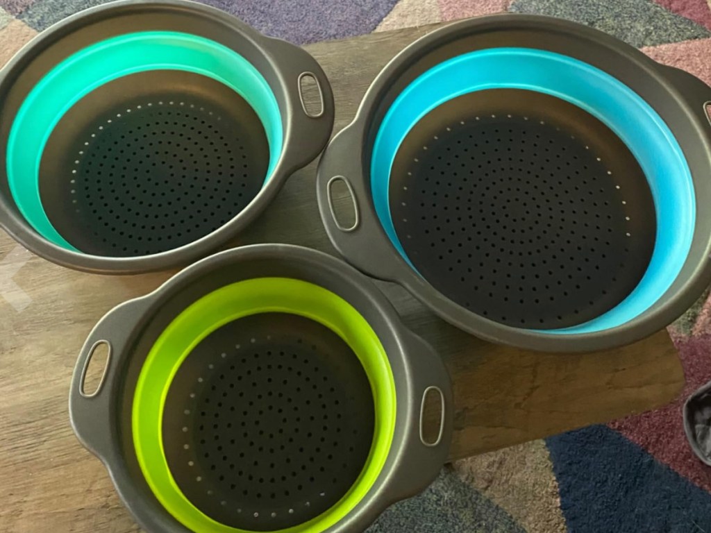 Collapsible Colanders on wood board