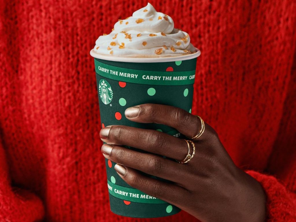 Hand holding a Starbucks Creme Brulee latte