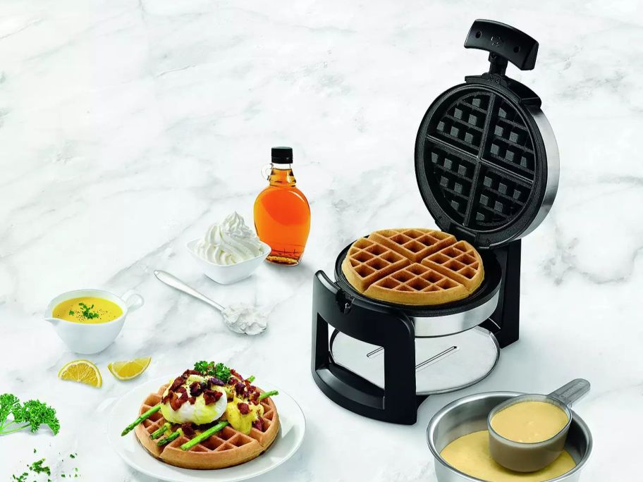 Cuisinart Flip Belgian Waffle Maker with waffles in front of it