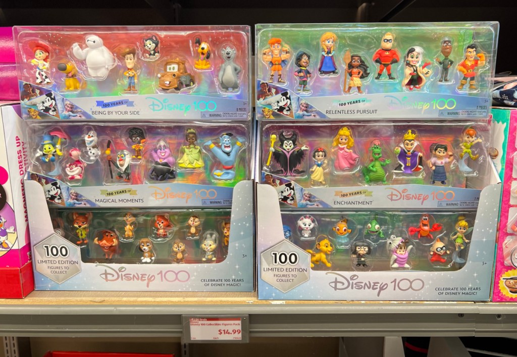 Several Disney 100 collectible figurine packs on an Aldi shelf