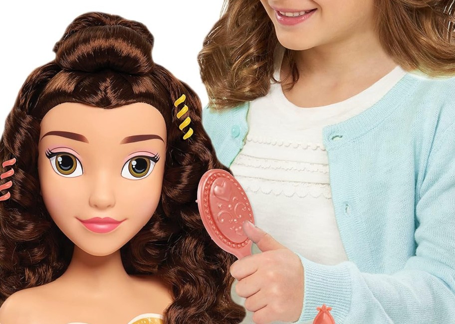 Disney belle doll being combed by little girl