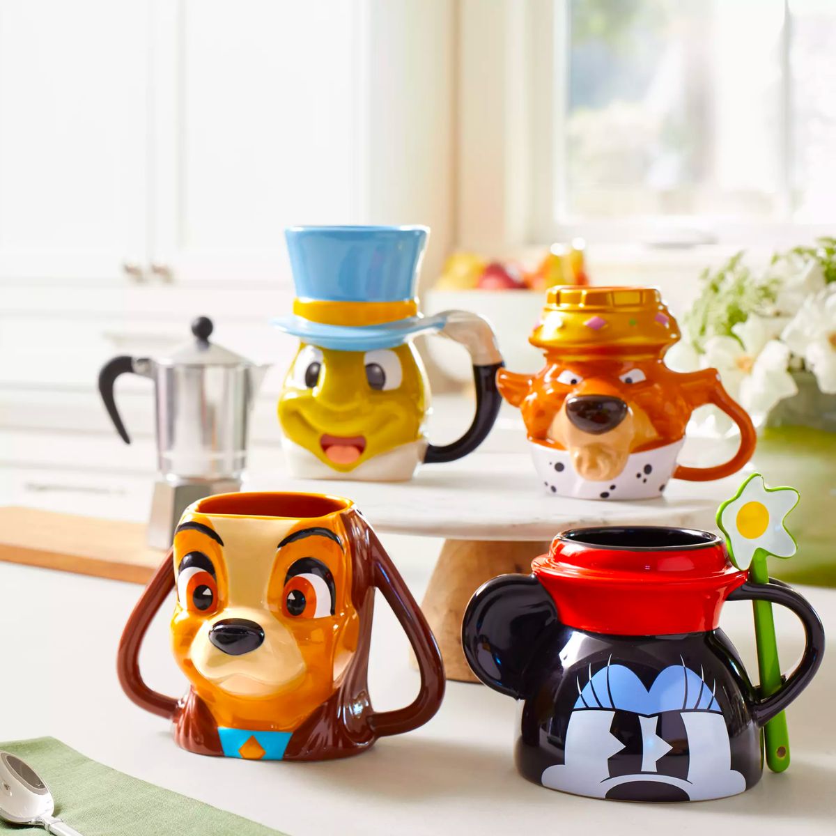 a set of Disney character Sculpted Mugs on a kitchen counter