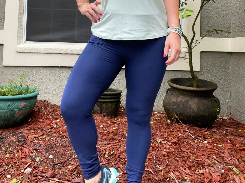 woman wearing dark blue leggings with light blue top