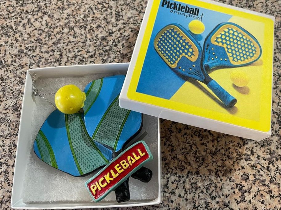 A Pickleball Ornament in a box