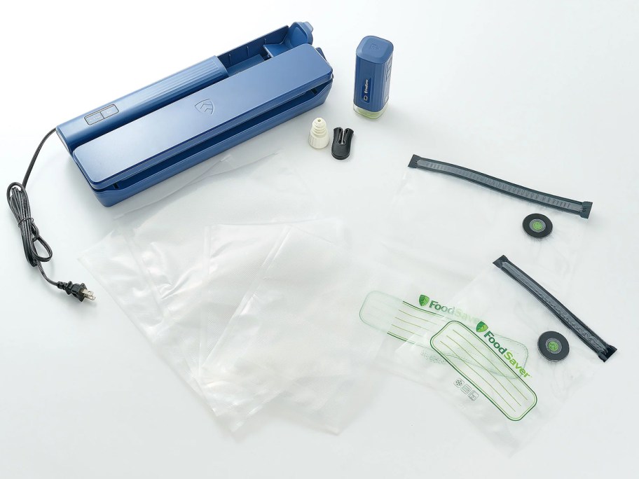 blue FoodSaver Vacuum Sealer with bags and accessories