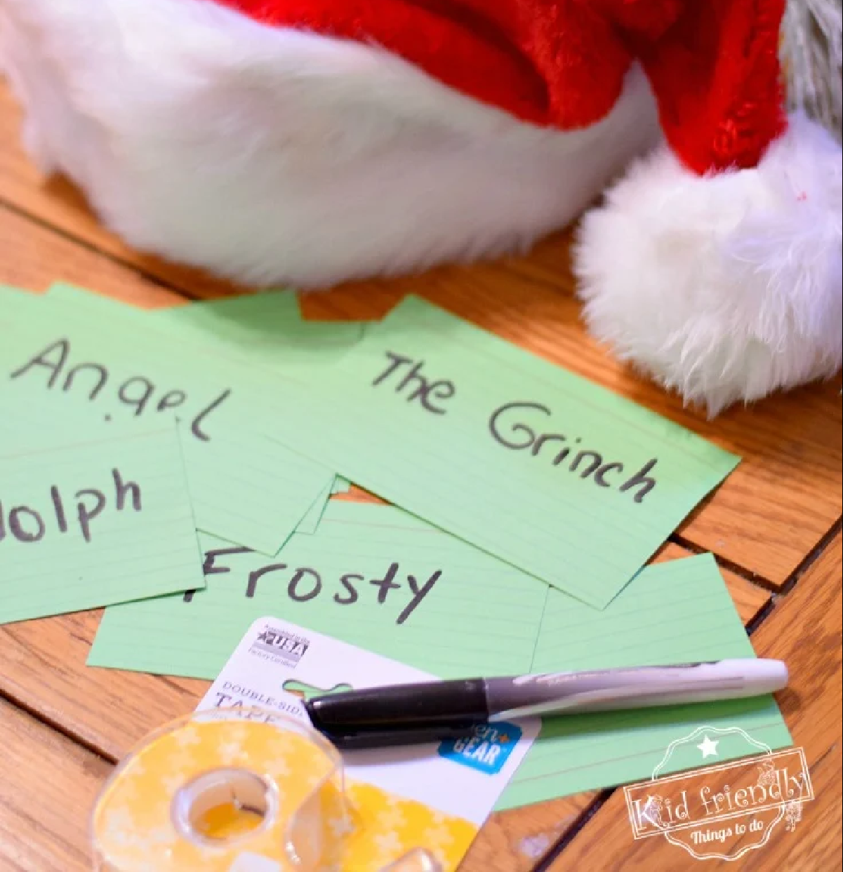 Notecards with christmas characters names on them for Guess Who?, one of the must-play Christmas party games