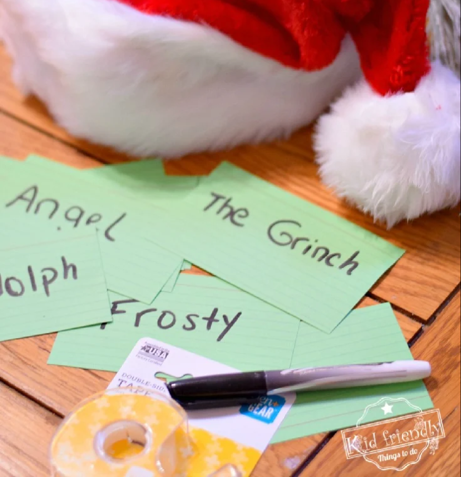 Notecards with christmas characters names on them for Guess Who?, one of the must-play Christmas party games