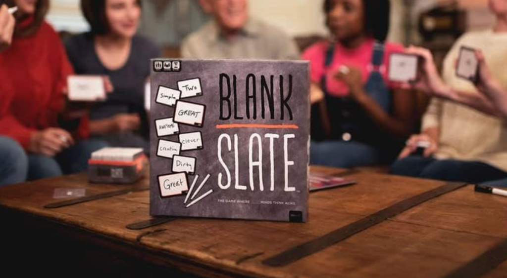 A family playing "Blank Slate" board game around a coffee table