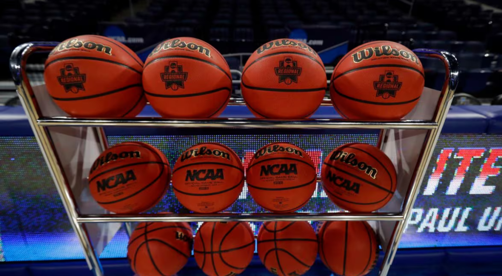 Wilson basketballs on a basketball rack at a NCAA game