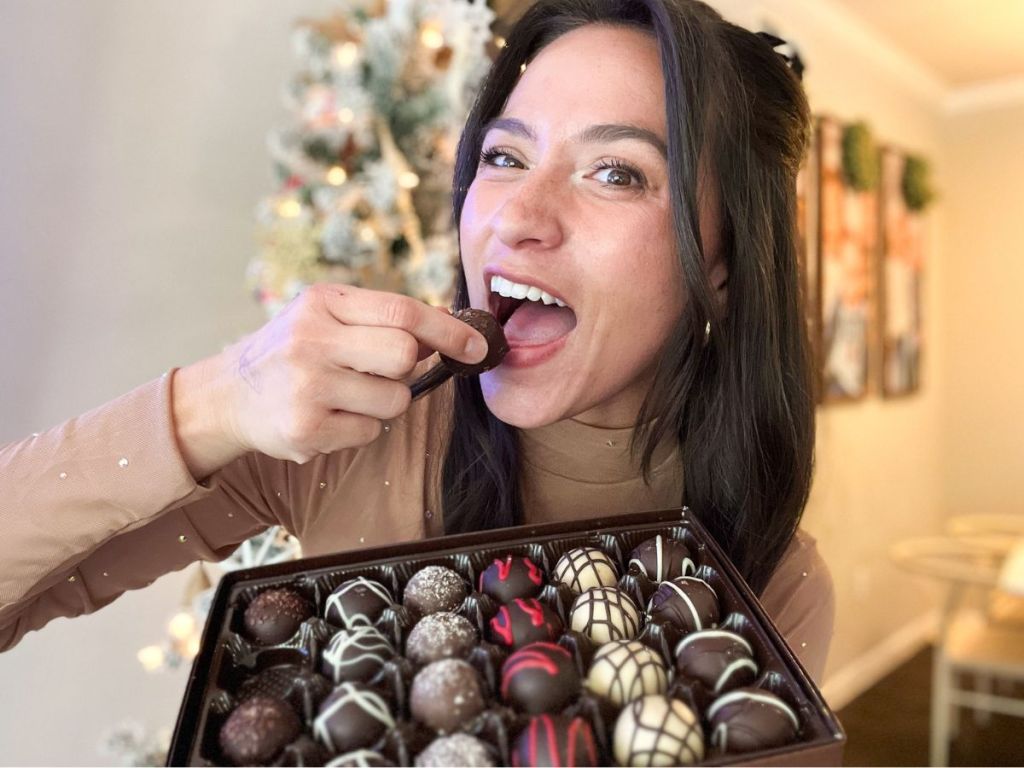 Chelsey holding a box of Harry & David Signature Chocolate Truffles 24-Count Box