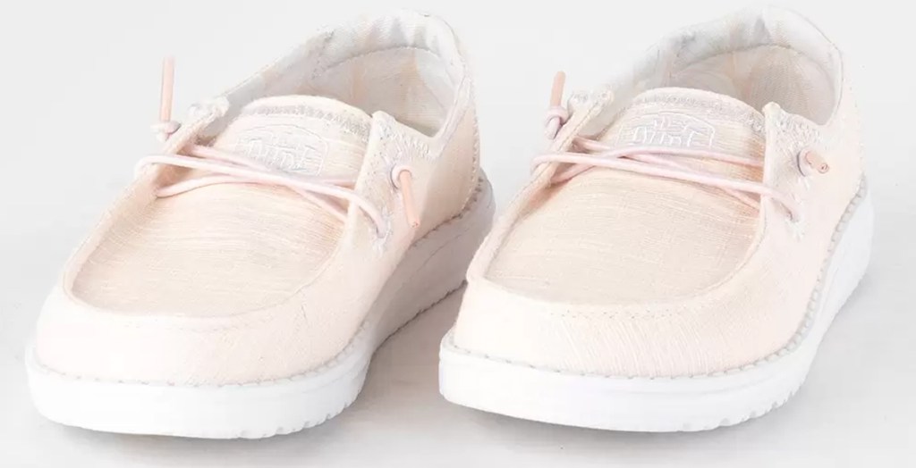 pair of light pink slip on shoes
