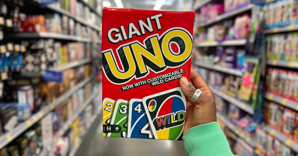 Giant Uno Cards Game in woman's hand at store