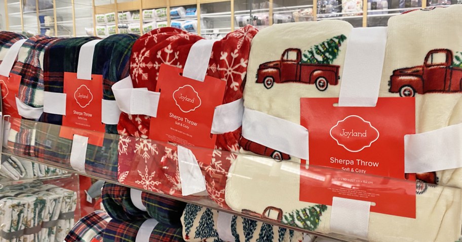 holiday throw blankets on Belk store display