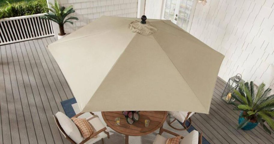 Home Decorators Collection 9 ft. Patio Umbrella on a picnic table