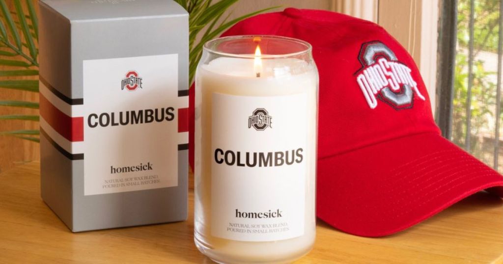 Homesick Columbus Candle with Ohio State Hat in the background