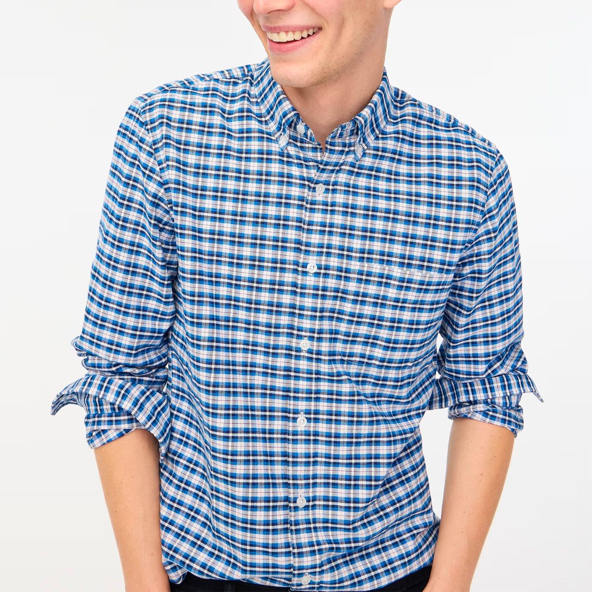 a model wearing a J. Crew Factory Plaid Flex Oxford Shirt in blue and white