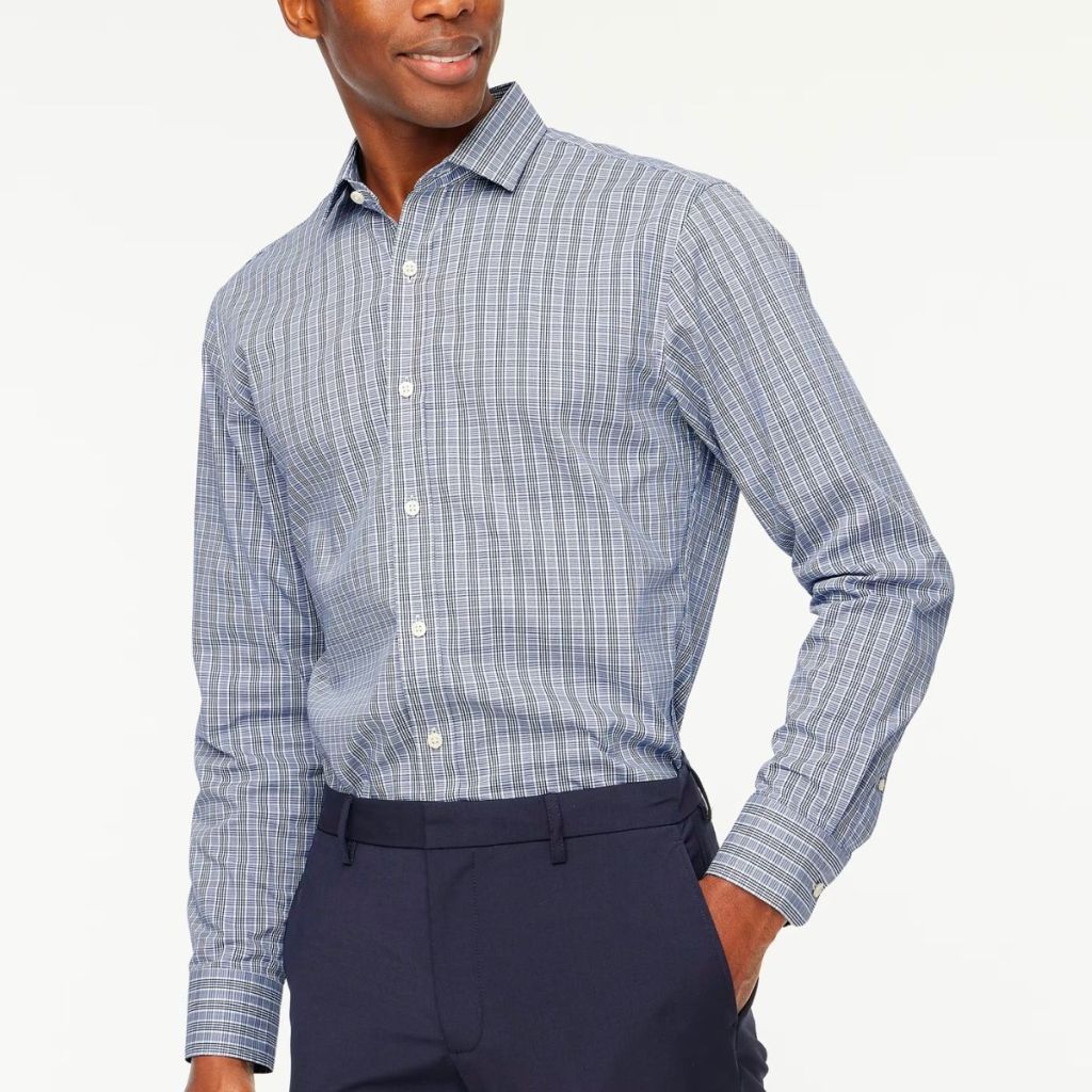 a model wearing a J. Crew Slim performance Dress Shirt in light blue and grey palid
