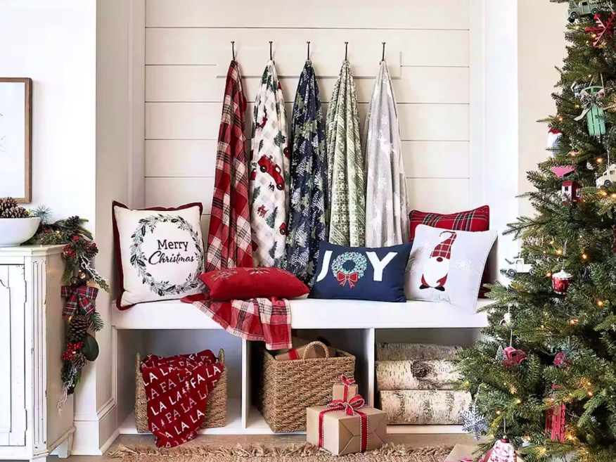 JCPenney holiday Blankets hanging on wall in home on hooks