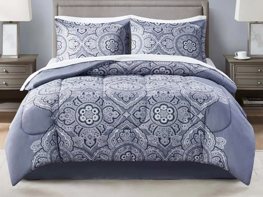 blue medallion print comforter on bed with matching shams