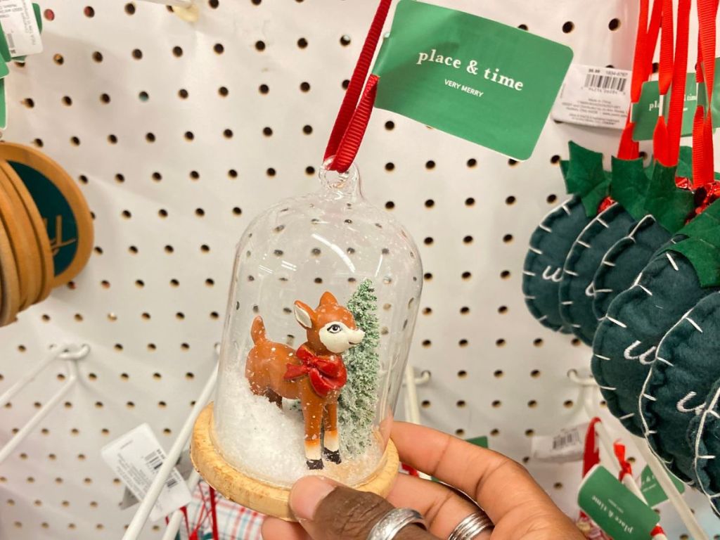 Hand holding an ornament at Joann Fabric