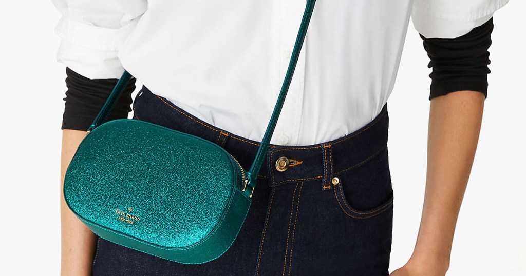 woman with green glittery oral shaped crossbody bag