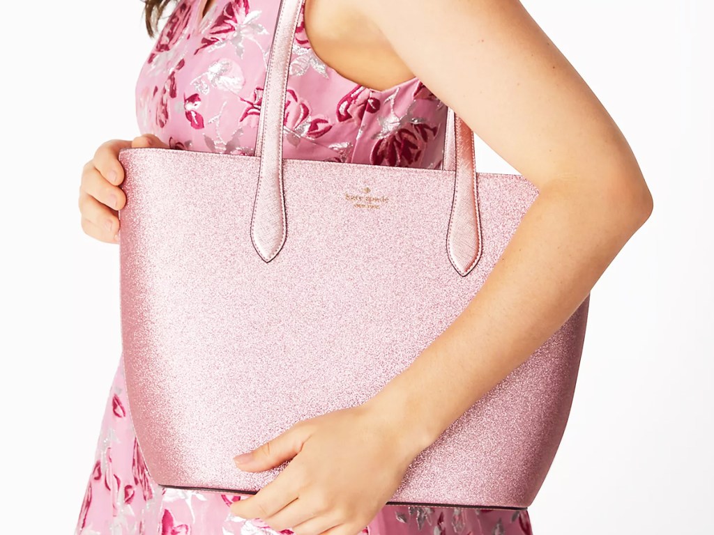 woman with pink glitter tote bag