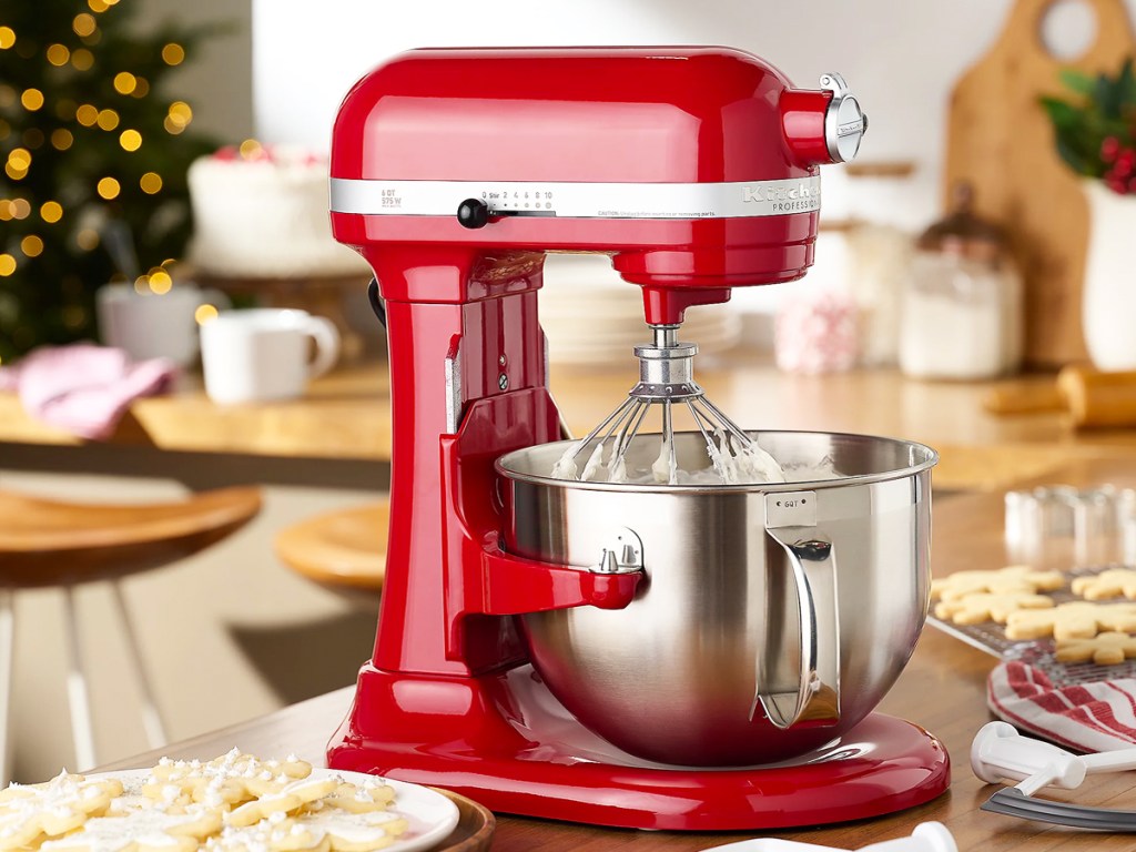 red kitchenaid mixer near christmas cookies