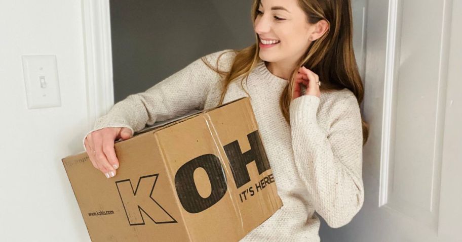 woman carrying a kohl's box