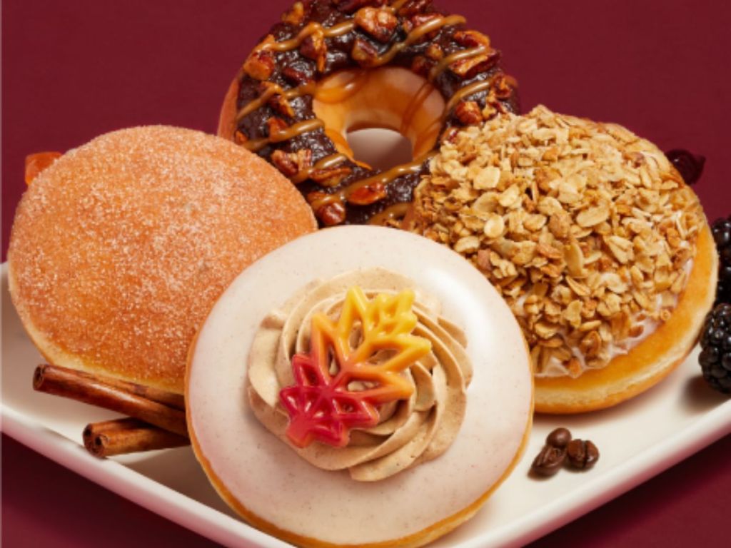 a plate of four of the Krispy Kreme Flavors of fall doughnuts