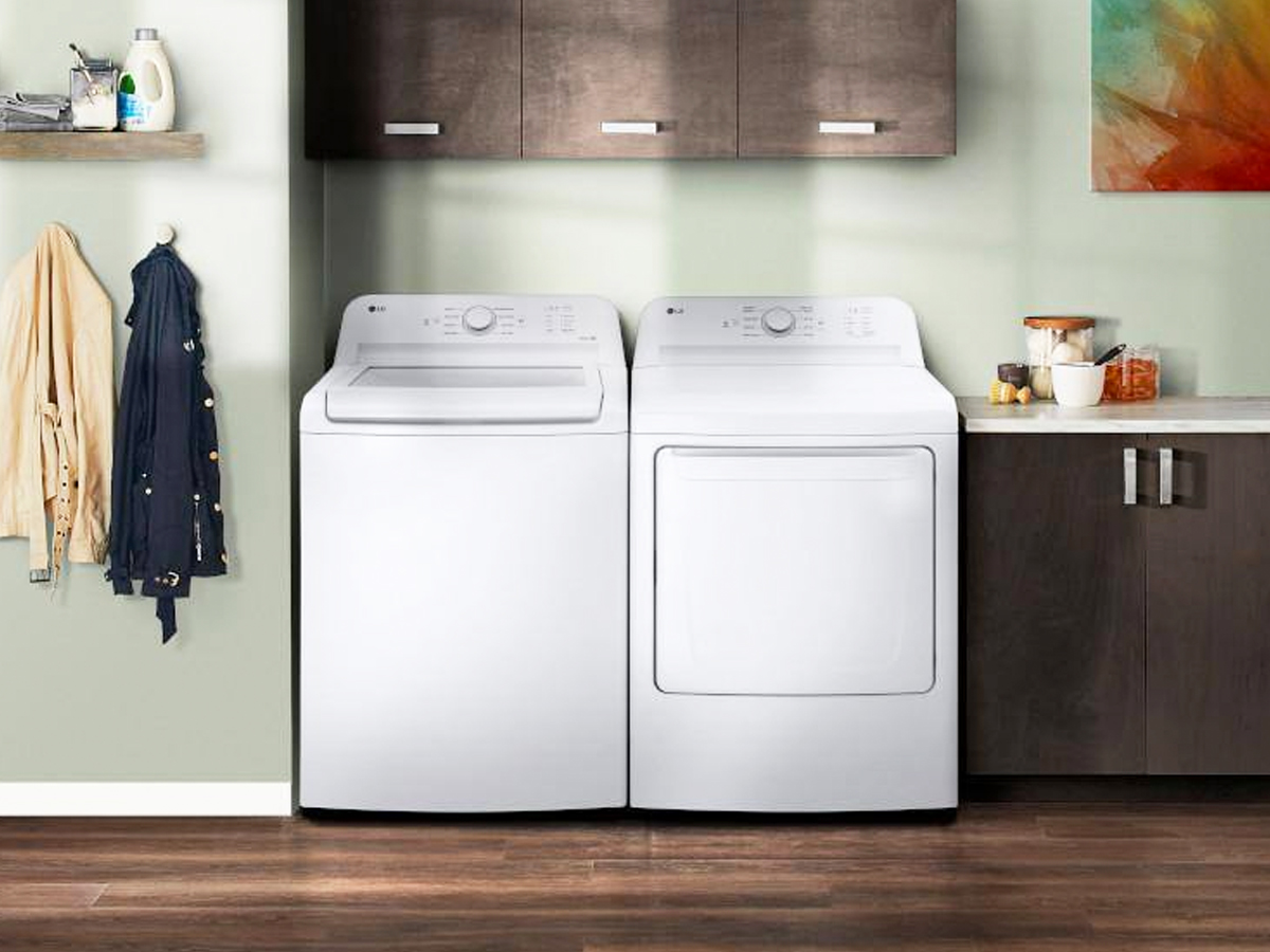white lg washer and dryer set in laundy room
