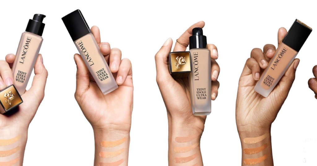 different hands holding up bottles of lancome TEINT IDOLE ULTRA WEAR FOUNDATION 
